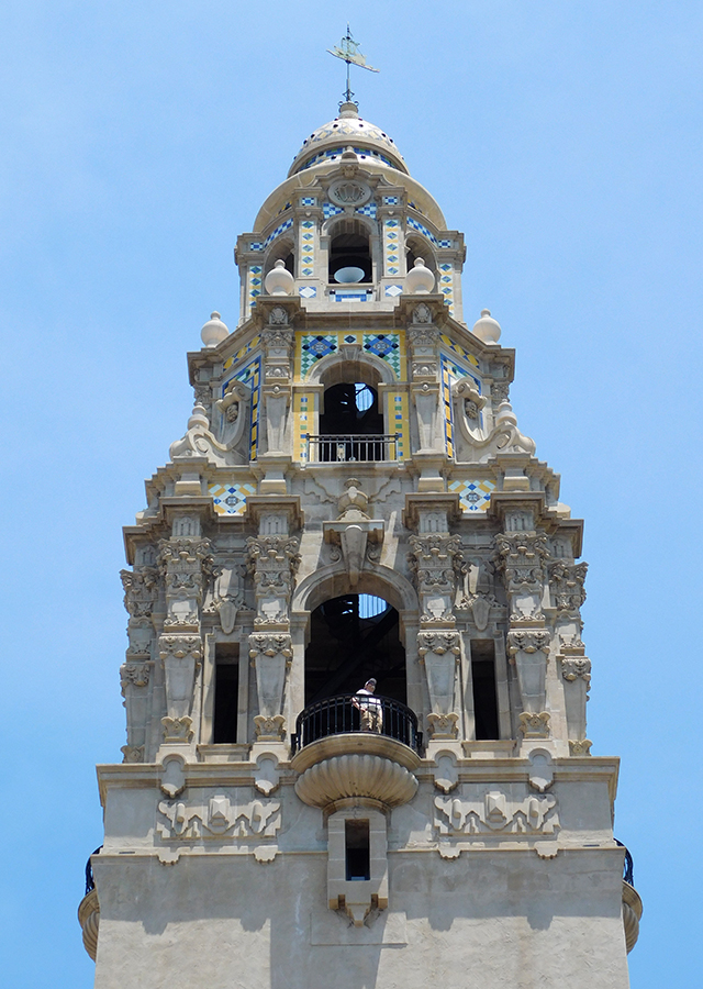 Close-up photo of man stinging in bell tower at Balboa Park